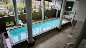 an overhead view of a swimming pool in a building at Urban Park Apartment in Durban +3 photos