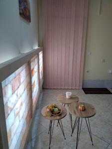 two tables with food on them in a room at Hostel Bata in Kanjiža