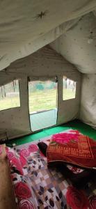 a bedroom in a tent with two beds in it at My Manali Adventure in Jibhi