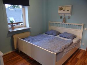 Uma cama ou camas num quarto em 2 BR beautyful vacation home / Ferienhaus Brunsberg