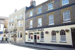 a building with a sign that reads calverts bars at Calverts Hotel - Newport, Isle of Wight - CAR FERRY TICKET from 109 Pounds in Newport