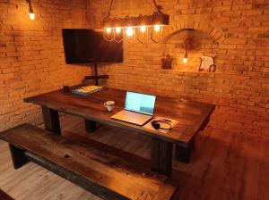 A television and/or entertainment centre at Napraszállás Vendégház