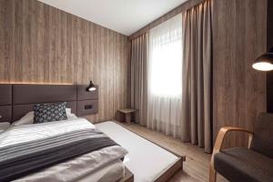 Ένα ή περισσότερα κρεβάτια σε δωμάτιο στο Trio Tatry Superior