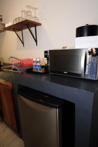 a microwave sitting on top of a kitchen counter at OSLO 5 in Mexico City