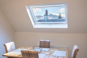 a room with a table and a window at MacFarlane Apartment in Taynuilt