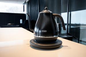 a black tea kettle sitting on top of a table at Sapporo - House - Vacation STAY 13790 in Sapporo