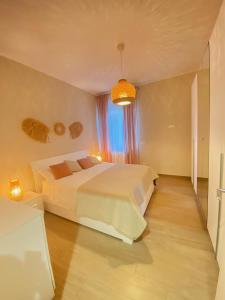 a bedroom with two beds and a window at Cà Sal Holiday Home in Lesina