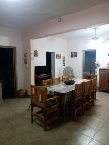 a dining room with a table and chairs at El Viejo Roble in Bragado