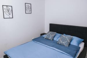 Posteľ alebo postele v izbe v ubytovaní Mazurski Apartament 2