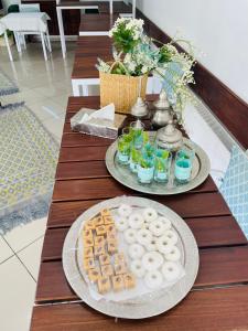 two plates of food and drinks on a table at Hotel Khella in Hammamet