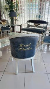 a room with two chairs and a table at Hotel Khella in Hammamet