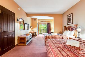 a hotel room with two beds and a balcony at Chula Vista Condo 2249 in Wisconsin Dells