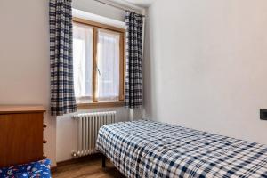 Posteľ alebo postele v izbe v ubytovaní Condominio Lucia 7