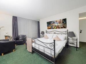 Postel nebo postele na pokoji v ubytování Hotel Rhyhof