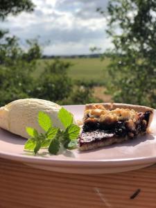 a plate with a piece of cake and a tortilla at Loft auf Fehmarn 800m zum Strand in Fehmarn