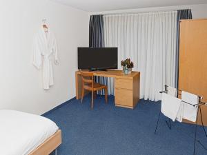 TV a/nebo společenská místnost v ubytování Hotel Rhyhof