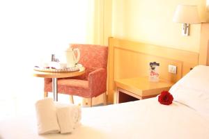 Postel nebo postele na pokoji v ubytování Best Western Hotel I Triangoli