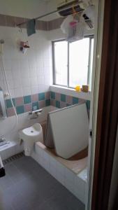 a bathroom with a toilet and a sink at Guesthouse Oomiya base 大宮基地別荘 in Chiba