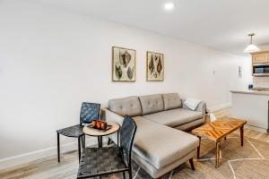 a living room with a couch and a table at Sandy Landing in Neskowin