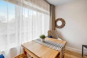 a dining room with a table and a window at Sandy Landing in Neskowin +15 photos