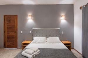 Postel nebo postele na pokoji v ubytování Barra Grande Beach Club