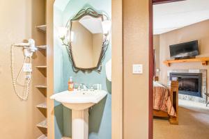 a bathroom with a sink and a mirror at Chula Vista Condo 2251 in Wisconsin Dells +19 photos