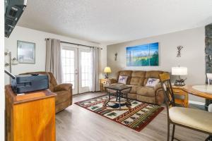 a living room with a couch and a table at The Moose Crossing in Anchorage