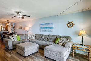 a living room with a couch and a table at Mariners Cay 23 in Folly Beach