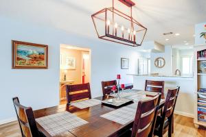 a kitchen and dining room with a table and chairs at Mariners Cay 23 in Folly Beach +31 photos