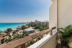 a view of the beach from the balcony of a resort at OceanView & Beach Access 3805 in Cancún