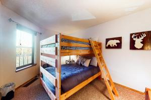 a bedroom with two bunk beds and a ladder at Mountainside Retreat in Frisco +44 photos