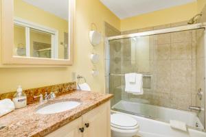 a bathroom with a sink and a shower and a toilet at Sand Dollar Villas 109 in Fernandina Beach