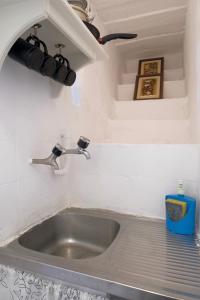 a sink in a kitchen with a counter top at Beco das Canas Apartment in Lisbon