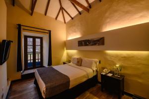 a bedroom with a bed and a window at Sonesta Posadas del Inca - Valle Sagrado Yucay Urubamba in Urubamba
