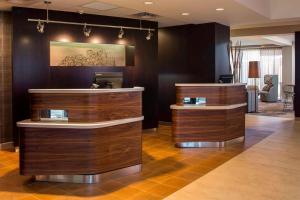 a salon with two wooden counters in a room at Sonesta Select Atlanta Norcross I 85 in Norcross +22 photos