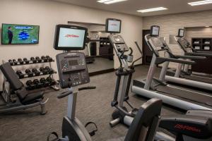 a gym with treadmills and elliptical machines at Sonesta Select Atlanta Norcross I 85 in Norcross