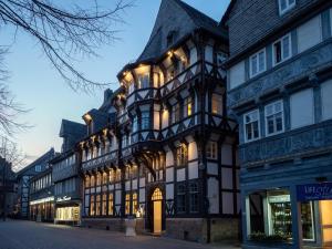 a large black and white building on a street at Ferienwohnung Casa Conti Goslar in Goslar