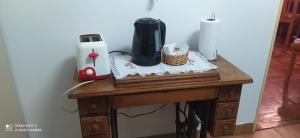 a wooden table with a blender on top of it at Coiron in Puerto Madryn