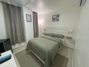 Postel nebo postele na pokoji v ubytování Hotel Conquistador Santo Domingo