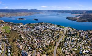 an aerial view of a town next to a lake at Ellswood 1 in Jindabyne