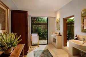 a bathroom with a sink and a toilet at Villa Inka Ubud by Nakula in Ubud