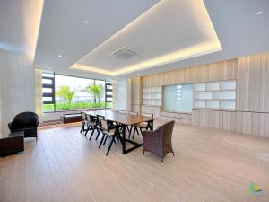 a dining room with a table and chairs at Bali Sea View Residences Melaka at Stayrene in Melaka