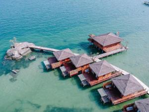an aerial view of a resort in the water at Rocks Beach Boutique in Phú Quốc