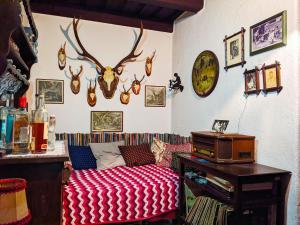 a living room with a couch and antlers on the wall at Holiday home in Edlitz in Wechselland with sauna in Edlitz