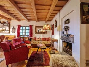 a living room with a couch and a fireplace at Holiday home in Edlitz in Wechselland with sauna in Edlitz