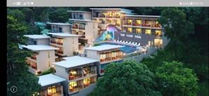 a large apartment building with lights on at Phi Phi Top View Resort in Phi Phi Islands
