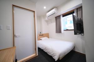 Postel nebo postele na pokoji v ubytování Ano Hotel Asakusa