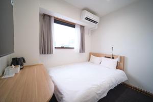 Postel nebo postele na pokoji v ubytování Ano Hotel Asakusa