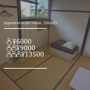 a small room with a bed and a window at HakoneHOSTEL1914 in Hakone