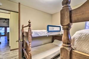 two bunk beds in a small room with a doorway at Lakefront Forestville Paradise with Private Beach! 